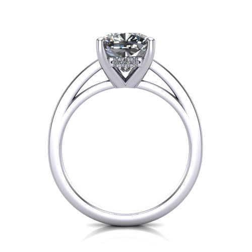 Itzel cushion-cut classic engagement ring in Platinum, through-finger front profile showing the hidden halo beneath the head
