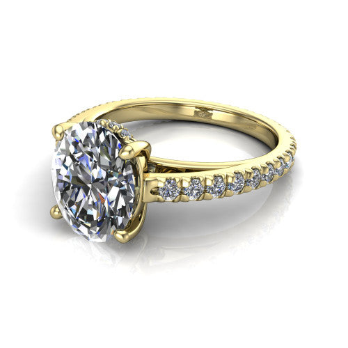 Jacqueline oval classic engagement ring in 14K Yellow Gold, three-quarter perspective showing the oval center diamond, double-claw prongs, and French pavé band