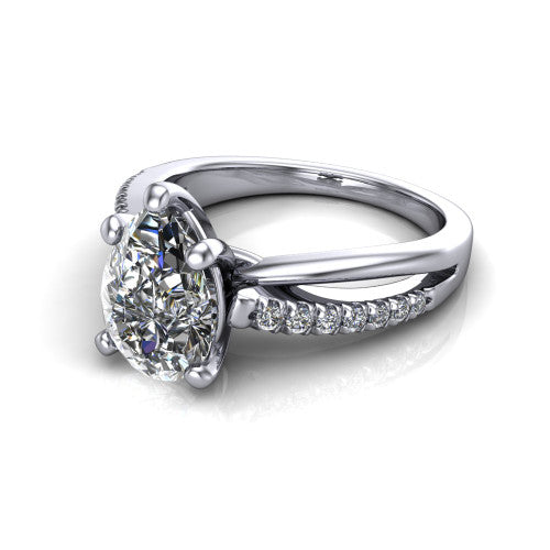 Marley pear solitaire engagement ring in Platinum, three-quarter perspective showing the pear center diamond above a split two-line pave shank