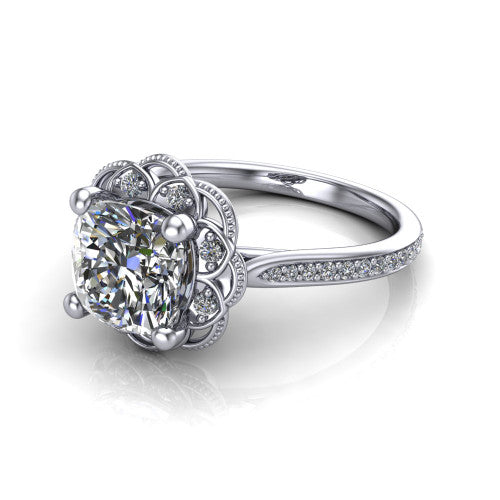 Mariana cushion-cut vintage halo engagement ring in Platinum, three-quarter perspective showing the cushion-cut center diamond, ornate floral halo, and pavé band