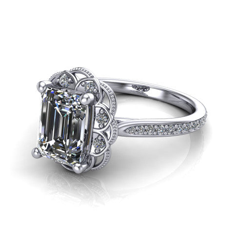 Mariana emerald-cut vintage halo engagement ring in Platinum, three-quarter perspective showing the emerald-cut center diamond, ornate floral halo, and pavé band