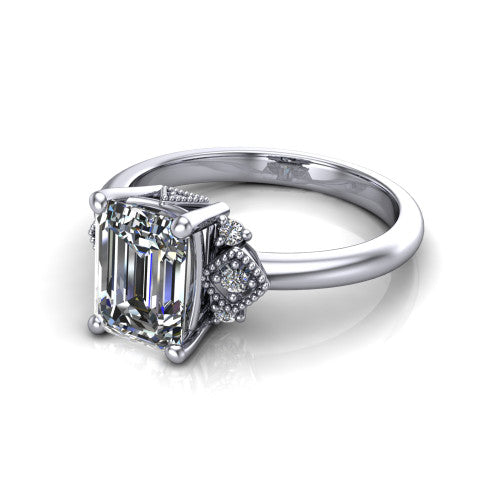 Harmony emerald-cut three stone engagement ring in 18K White Gold, three-quarter perspective showing the emerald-cut center diamond, diamond side clusters, and polished band