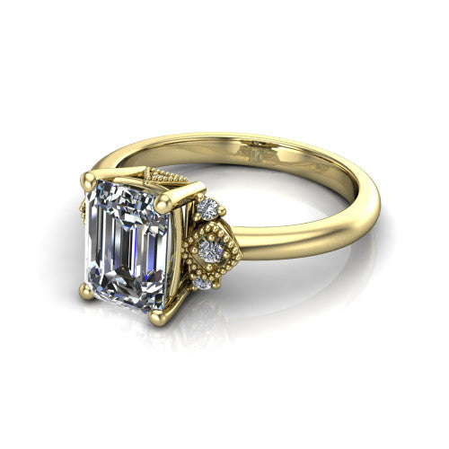 Harmony emerald-cut three stone engagement ring in 18K Yellow Gold, three-quarter perspective showing the emerald-cut center diamond, diamond side clusters, and polished band