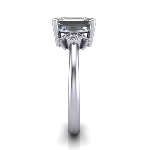 Harmony emerald-cut three stone engagement ring in 14K White Gold, side profile showing the diamond side clusters and polished band