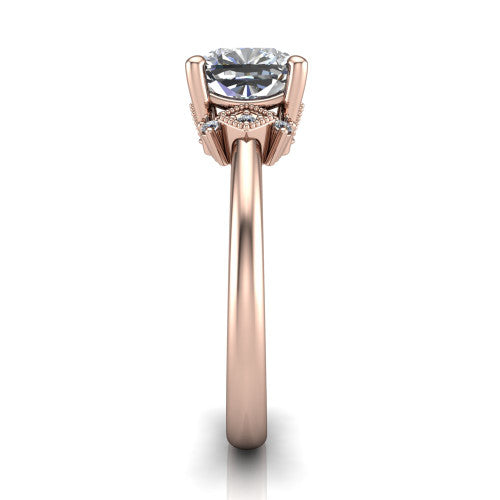 Harmony cushion-cut three stone engagement ring in 18K Rose Gold, side profile showing the diamond side clusters and polished band