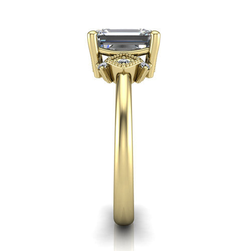 Harmony emerald-cut three stone engagement ring in 14K Yellow Gold, side profile showing the diamond side clusters and polished band