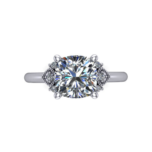 Harmony cushion-cut three stone engagement ring in 18K White Gold, top-down view showing the cushion-cut center diamond flanked by milgrain diamond clusters