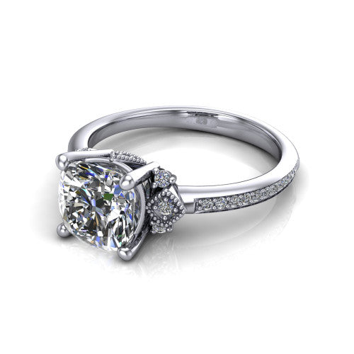 Presley cushion-cut three stone engagement ring in Platinum, three-quarter perspective showing the cushion-cut center diamond, diamond side clusters, and pavé band
