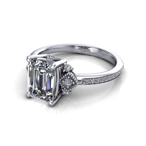 Presley emerald-cut three stone engagement ring in Platinum, three-quarter perspective showing the emerald-cut center diamond, diamond side clusters, and pavé band