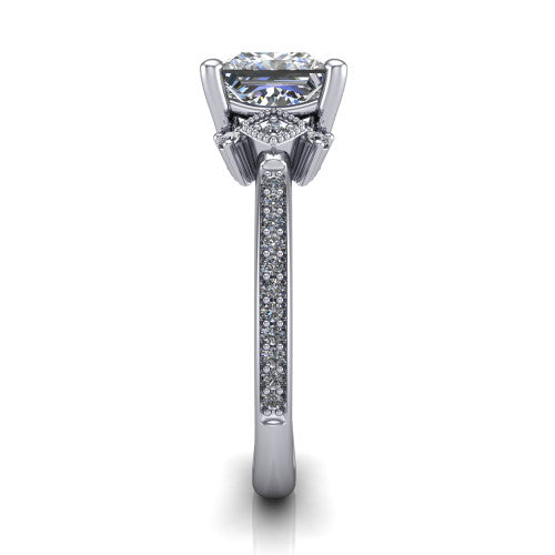 Presley princess-cut three stone engagement ring in Platinum, side profile showing the diamond side clusters and pavé band