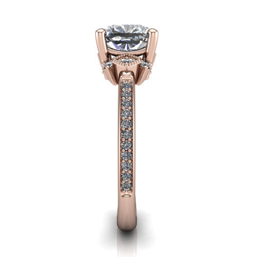 Presley cushion-cut three stone engagement ring in 14K Rose Gold, side profile showing the diamond side clusters and pavé band