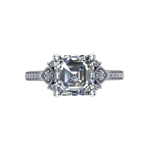 Presley square emerald-cut three stone engagement ring in 18K White Gold, top-down view showing the square emerald-cut center diamond flanked by milgrain diamond clusters