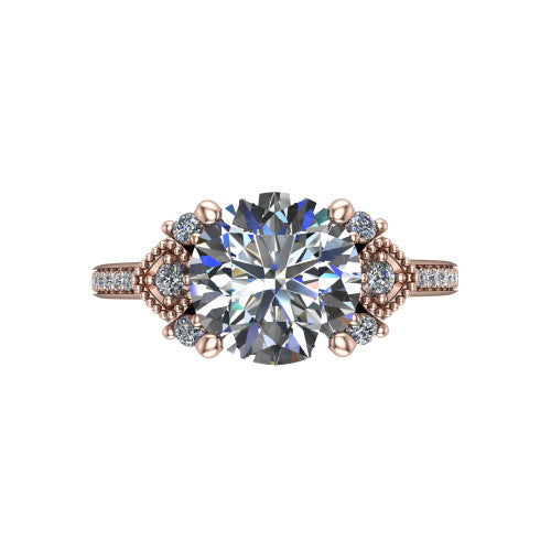 Presley round three stone engagement ring in 14K Rose Gold, top-down view showing the round center diamond flanked by milgrain diamond clusters