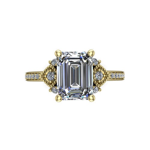 Presley emerald-cut three stone engagement ring in 18K Yellow Gold, top-down view showing the emerald-cut center diamond flanked by milgrain diamond clusters