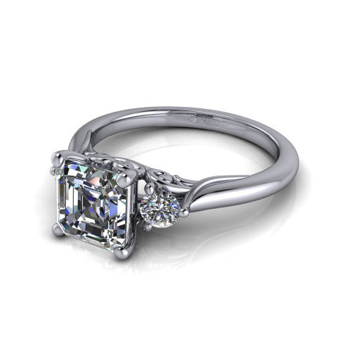 Harley square emerald three stone engagement ring in 14K White Gold, three-quarter perspective showing the step-cut square emerald center diamond flanked by two round side diamonds on tapered cathedral shoulders