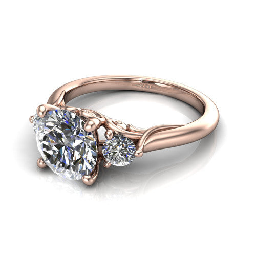 Harley round three stone engagement ring in 14K Rose Gold, three-quarter perspective showing the brilliant round center diamond flanked by two round side diamonds on tapered cathedral shoulders