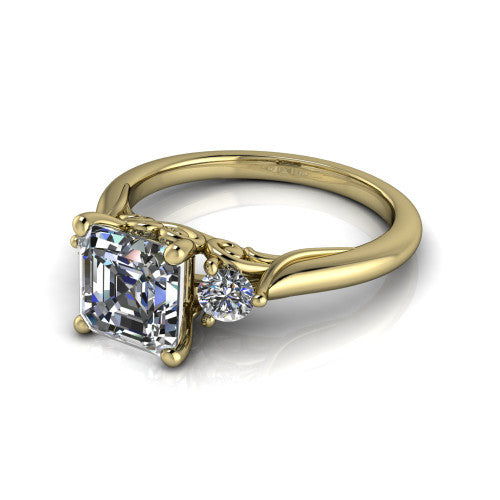 Harley square emerald three stone engagement ring in 14K Yellow Gold, three-quarter perspective showing the step-cut square emerald center diamond flanked by two round side diamonds on tapered cathedral shoulders