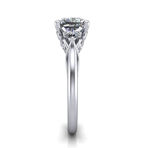 Harley cushion three stone engagement ring in Platinum, side profile showing the filigree scroll gallery, tapered cathedral shoulders, and polished band