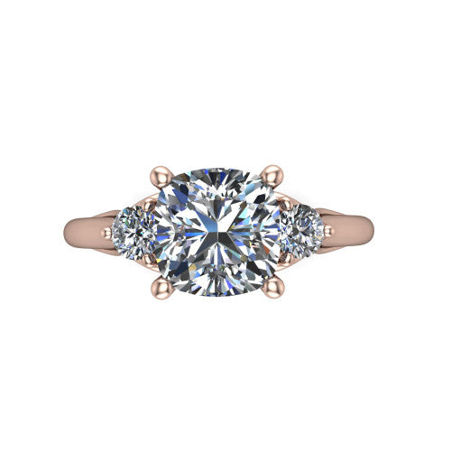 Harley cushion three stone engagement ring in 18K Rose Gold, top-down view showing the brilliant cushion-cut center diamond with two matched round side diamonds