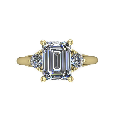 Harley emerald three stone engagement ring in 18K Yellow Gold, top-down view showing the step-cut emerald center diamond with two matched round side diamonds
