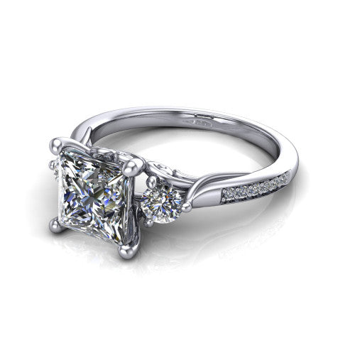 Celine princess three stone engagement ring in 14K White Gold, three-quarter perspective showing the brilliant princess-cut center diamond flanked by two round side diamonds on a pave band