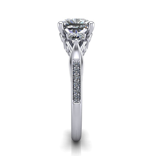 Celine cushion three stone engagement ring in Platinum, through-finger front profile showing the three-stone head and filigree scrollwork under-gallery
