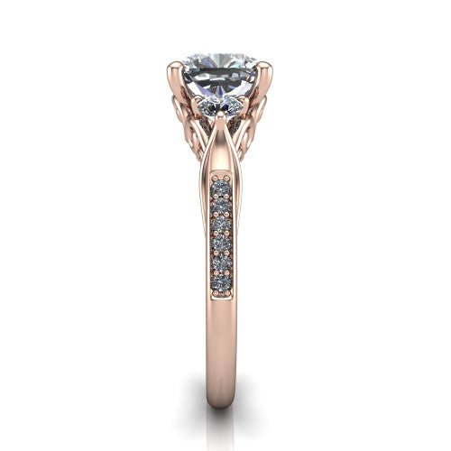 Celine cushion three stone engagement ring in 18K Rose Gold, side profile showing the filigree gallery and pave diamond band along the shoulders