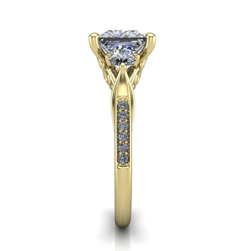 Celine princess three stone engagement ring in 14K Yellow Gold, side profile showing the filigree gallery and pave diamond band along the shoulders