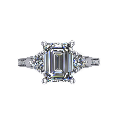 Celine emerald three stone engagement ring in Platinum, top-down view showing the step-cut emerald center diamond with two matched round side diamonds