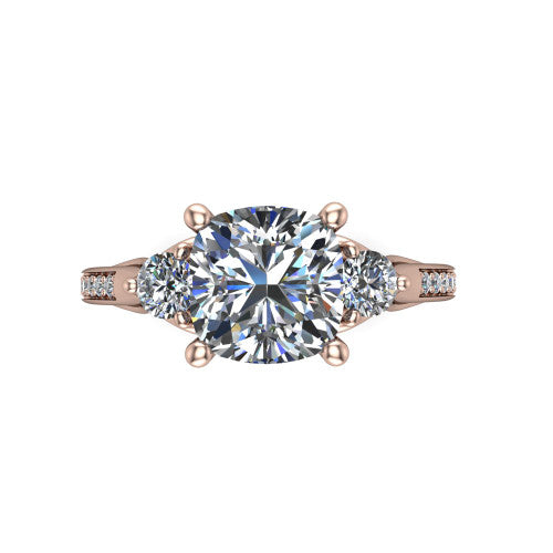 Celine cushion three stone engagement ring in 18K Rose Gold, top-down view showing the brilliant cushion-cut center diamond with two matched round side diamonds