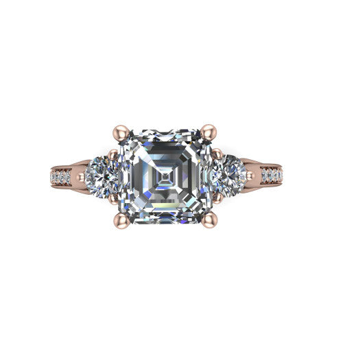 Celine square emerald three stone engagement ring in 14K Rose Gold, top-down view showing the step-cut square emerald center diamond with two matched round side diamonds