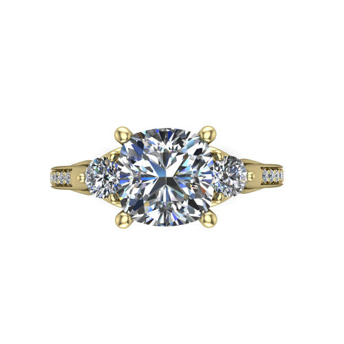 Celine cushion three stone engagement ring in 18K Yellow Gold, top-down view showing the brilliant cushion-cut center diamond with two matched round side diamonds