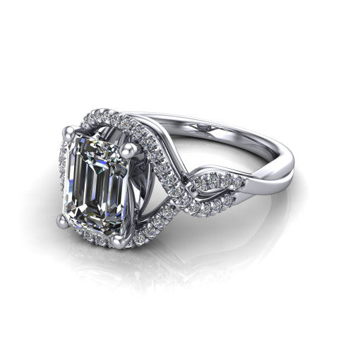 River emerald halo engagement ring in 18K White Gold, three-quarter perspective showing the step-cut emerald center diamond inside a pave halo on a twisted criss-cross pave split shank