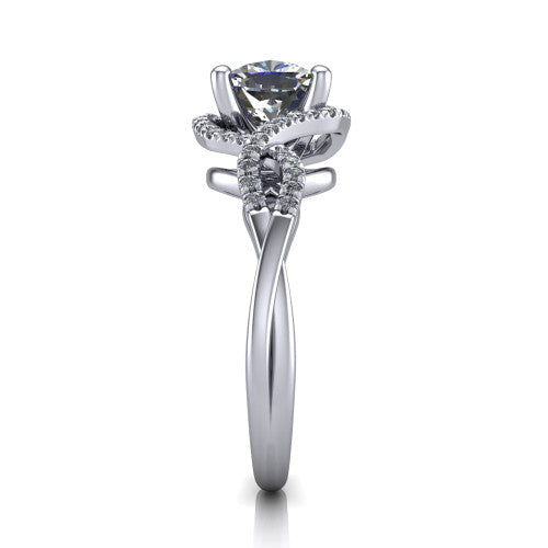 River cushion halo engagement ring in Platinum, side profile showing the twisted criss-cross pave split shank braiding beneath the halo