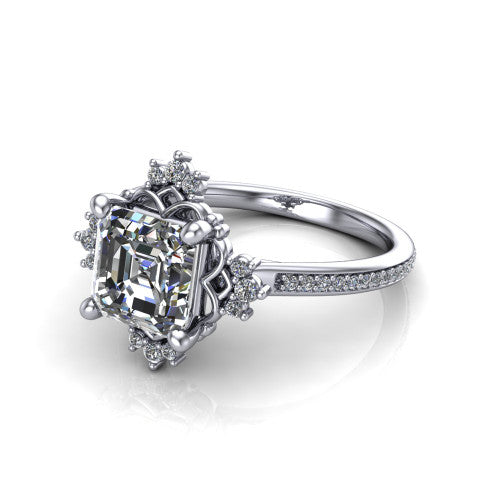 Jayla square emerald solitaire engagement ring in Platinum, three-quarter perspective showing the step-cut square emerald center diamond inside an ornate floral openwork frame on a pave band