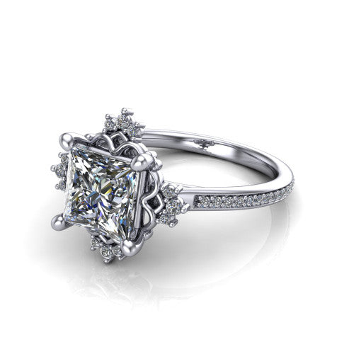 Jayla princess solitaire engagement ring in Platinum, three-quarter perspective showing the brilliant princess-cut center diamond inside an ornate floral openwork frame on a pave band