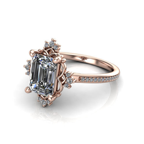 Jayla emerald solitaire engagement ring in 14K Rose Gold, three-quarter perspective showing the step-cut emerald center diamond inside an ornate floral openwork frame on a pave band