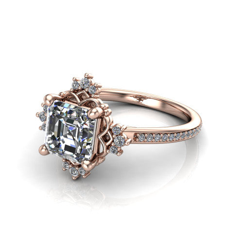 Jayla square emerald solitaire engagement ring in 18K Rose Gold, three-quarter perspective showing the step-cut square emerald center diamond inside an ornate floral openwork frame on a pave band