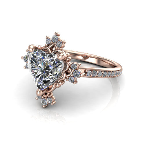 Jayla heart solitaire engagement ring in 14K Rose Gold, three-quarter perspective showing the brilliant heart-shaped center diamond inside an ornate floral openwork frame on a pave band
