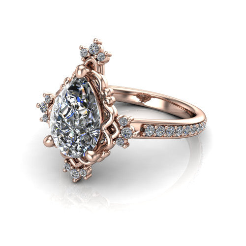 Jayla pear solitaire engagement ring in 14K Rose Gold, three-quarter perspective showing the brilliant pear-cut center diamond inside an ornate floral openwork frame on a pave band
