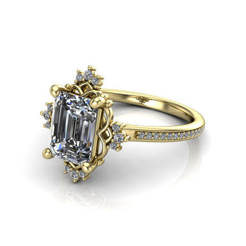 Jayla emerald solitaire engagement ring in 18K Yellow Gold, three-quarter perspective showing the step-cut emerald center diamond inside an ornate floral openwork frame on a pave band