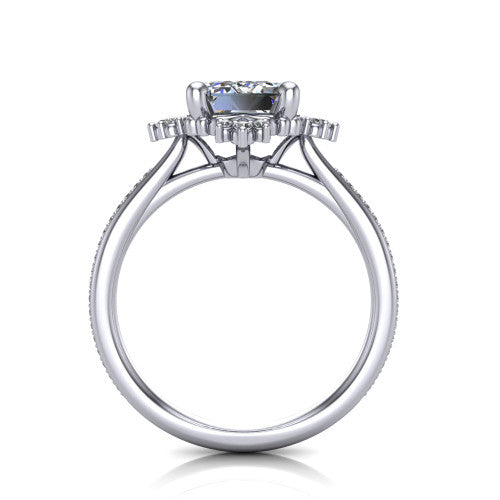 Jayla emerald solitaire engagement ring in Platinum, through-finger front profile showing the floral frame, cathedral lift, and open under-gallery
