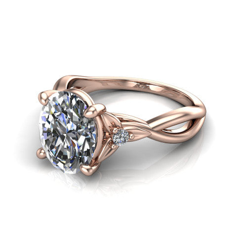 Catalina oval three stone engagement ring in 18K Rose Gold, three-quarter perspective showing the brilliant oval center diamond flanked by two round side accent diamonds on a twisted infinity shank