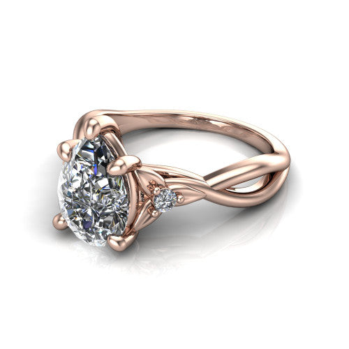 Catalina pear three stone engagement ring in 18K Rose Gold, three-quarter perspective showing the brilliant pear-cut center diamond flanked by two round side accent diamonds on a twisted infinity shank
