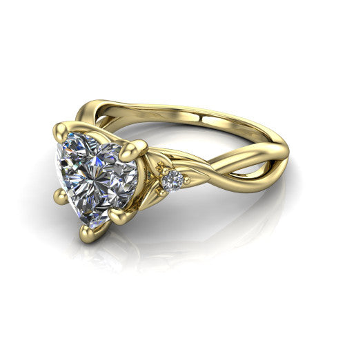 Catalina heart three stone engagement ring in 18K Yellow Gold, three-quarter perspective showing the brilliant heart-shaped center diamond flanked by two round side accent diamonds on a twisted infinity shank