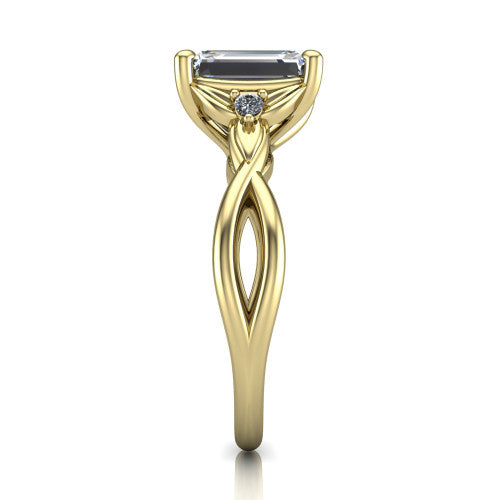 Catalina emerald three stone engagement ring in 14K Yellow Gold, side profile showing the twisted infinity shank braiding beneath the head into a polished band