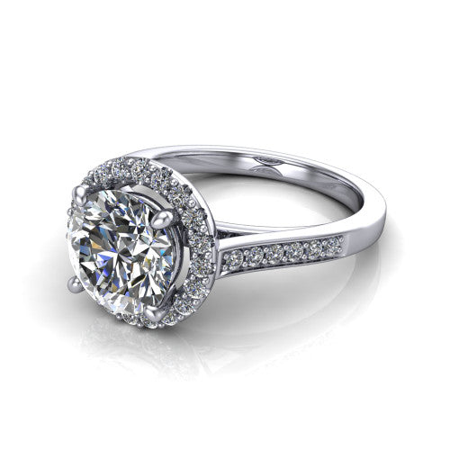 Brooke round halo engagement ring in Platinum, three-quarter perspective showing the haloed center above a slim pav&eacute; band with a peekaboo gallery accent