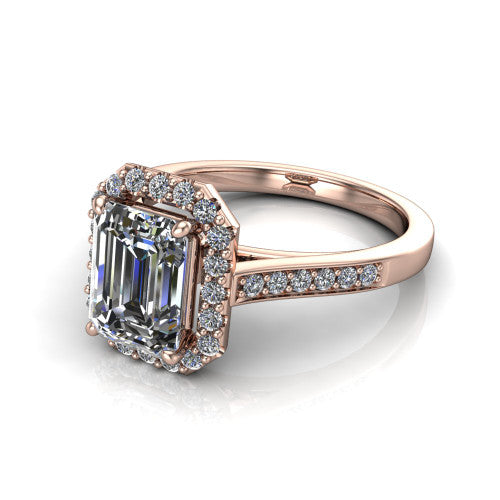 Brooke emerald halo engagement ring in 18K Rose Gold, three-quarter perspective showing the haloed center above a slim pav&eacute; band with a peekaboo gallery accent