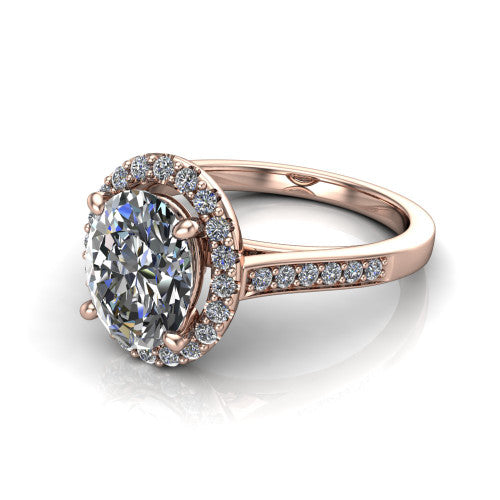 Brooke oval halo engagement ring in 14K Rose Gold, three-quarter perspective showing the haloed center above a slim pav&eacute; band with a peekaboo gallery accent