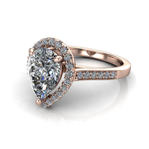 Brooke pear halo engagement ring in 14K Rose Gold, three-quarter perspective showing the haloed center above a slim pav&eacute; band with a peekaboo gallery accent